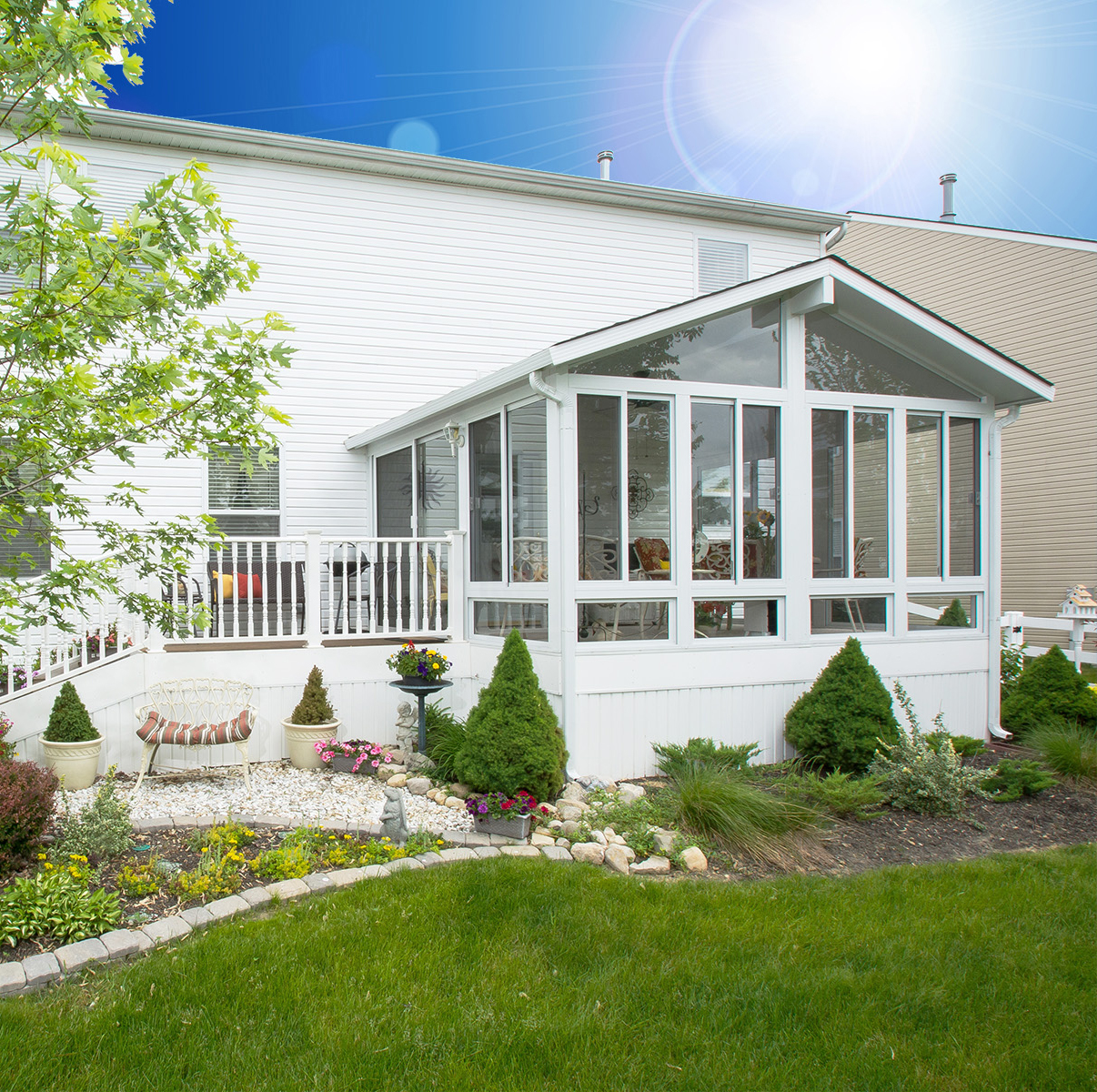 Bright new sunroom on white home