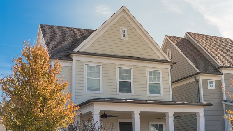 Cottage Style House With Covered Patio And Wood Siding With Ceiling Fans Near Dallas