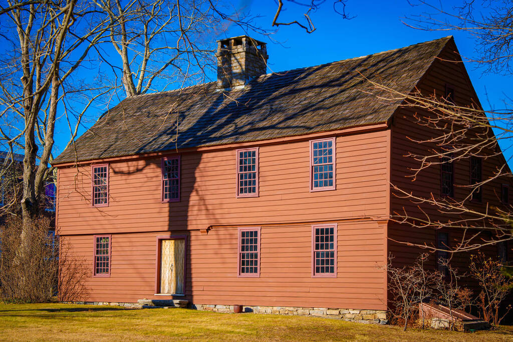 A saltbox roof on a charming country style home